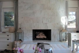 Glamorous living room with a marble fireplace