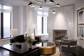 Glamorous living room with a white marble fireplace