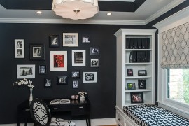 Gorgeous black and white home office with window seat and a craft closet