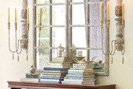 Gorgeous entryway with a Grand Chateau Window Mirror and large scones