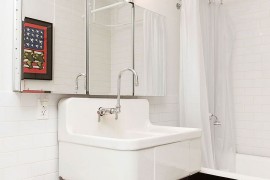 Industrial bathroom in white with vintage bathtub and shower area