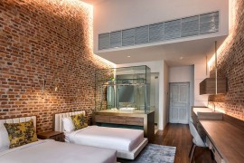 LED cove lighting for the brick walls creates a cozy, etheral setting inside the suites