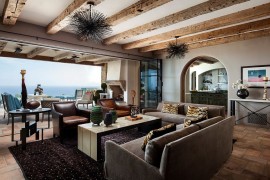 Living opens up towards the deck and the ocean views outside