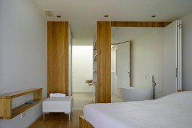 Master bedroom and bathroom become one with the use of stackable doors