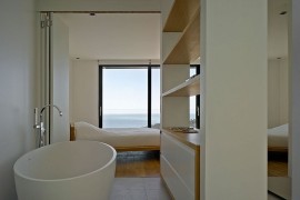 Master suite of the French villa with a view of the distant sea