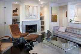 Modern white living room with a marble fireplace
