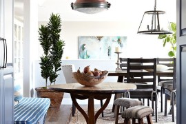Oak flooring and simple dining room decor create a relaxing ambiance [Design: Janette Mallory Interior Design]
