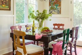 Old painted chairs and table give the dining room a classical element