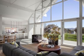 Open living area of the lovely home with a rustic backdrop