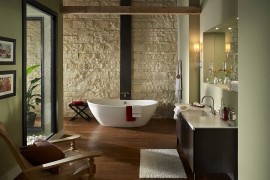Oyster Cut Coarse Stone shapes the fabulous backdrop in this zen-styled modern bathroom