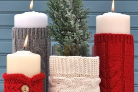 Pillar candles with knitted sweater sleeves