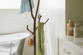 Recycled metal branch coat tree in bathroom