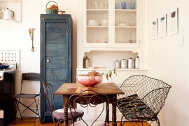 Repainted vintage cabinet, reclaimed decor and fabulous furniture shape the smart dining room