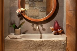 Rustic powder room with bespoke sandstone countertop and integral sink