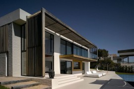 Shaded structure of the house serves as a lovely pergola on hot summer days