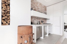 Smart wall storage tucks away the kitchen appliances and holds additional cabinets
