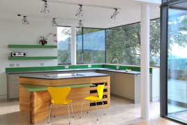 Spotlights in a kitchen with green accents