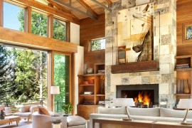 Stunning art workk blends in with the colors of the fireplace wall