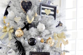 Stunning white Christmas tree with gold, black, and white decorations