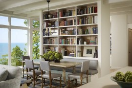 Wall of books also helps delineate space inside this contemporary home