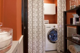 Washer and dryer hidden behind a great looking curtain