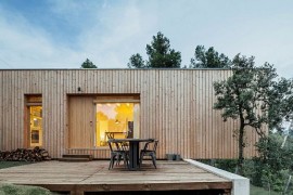 Cantilevered portion of the wooden home adds to the dramatic appeal of the exterior