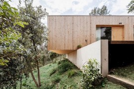 Lightweight wooden contruction on retaining walls creates a home with minimal footprint