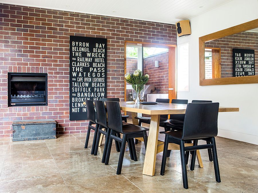 dining room with brick wall