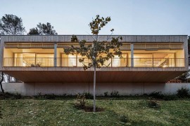 Wooden structure and beautiful lighting turn the home into an inviting hub