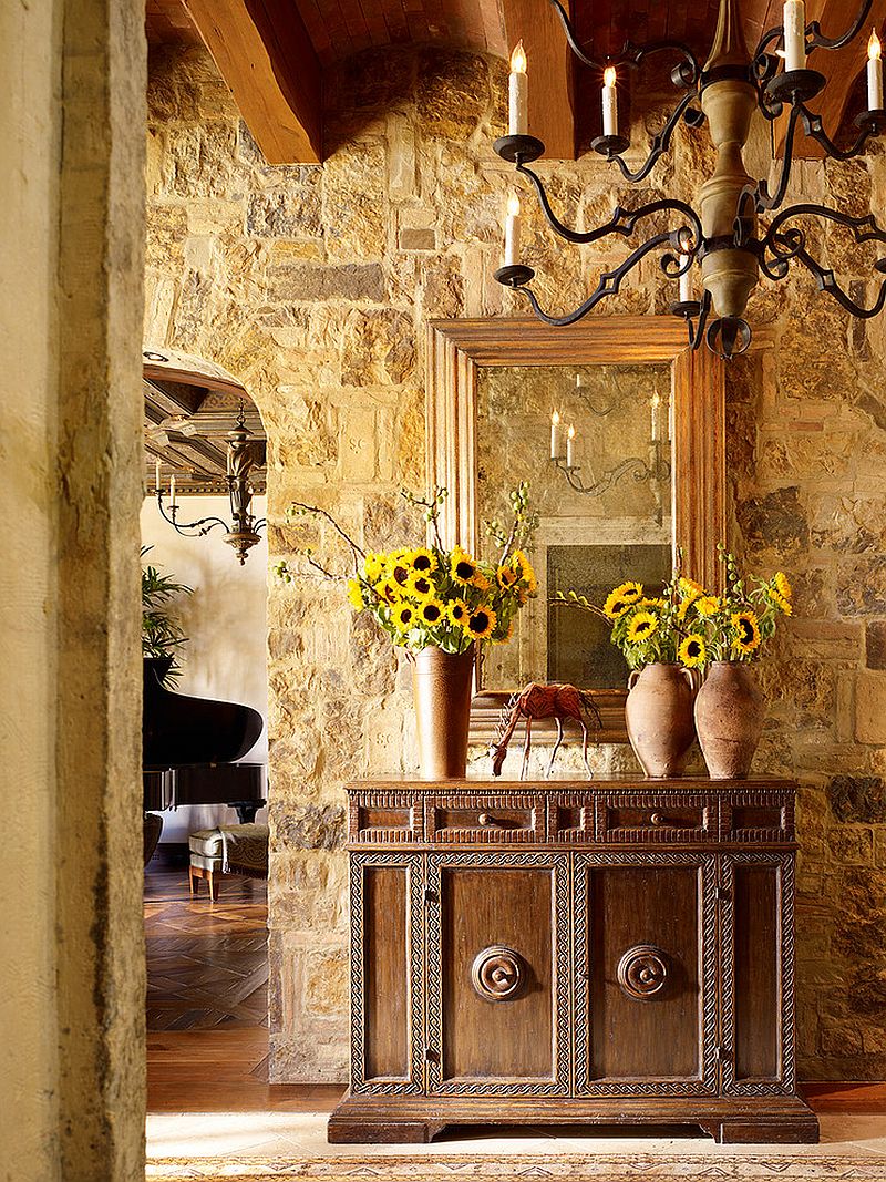 Stone walls and custom decor give the entry a Tuscan flavor - Decoist