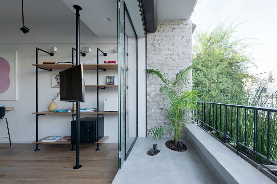 Beautiful little balcony of small apartment extends the living space outdoors