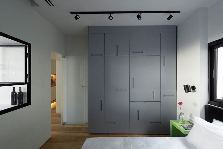 Custom bedroom wardrobe with uniquely placed handles