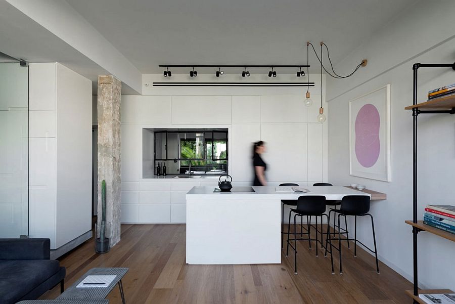 Extended kitchen island acts as a cool dining table and also helps demarcate space