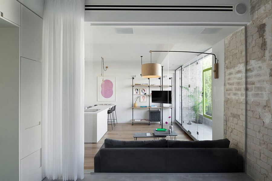 View of the living area from the bedroom of the tint apartment