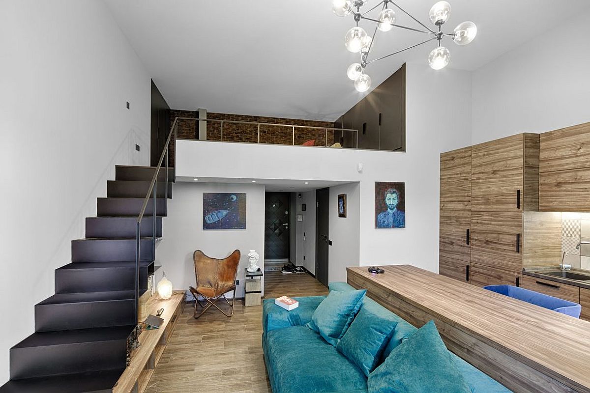 Look at the living area and mezzanine level of the ultra small apartment in Kiev