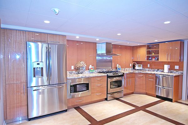 stainless steel kitchen with wooden cabinets