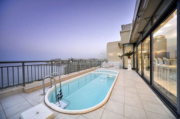 Luxury penthouse outdoor pool and glass living area