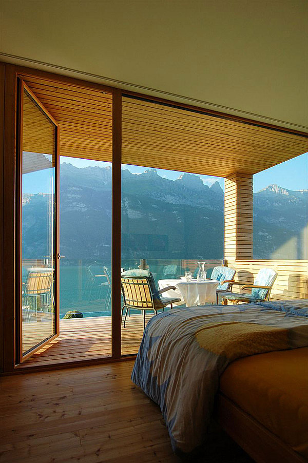 Wohnhaus Am Walensee - wooden bedroom with stunning lake mountain views