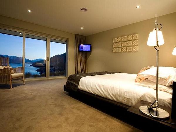 bedroom with glass doors and stunning views