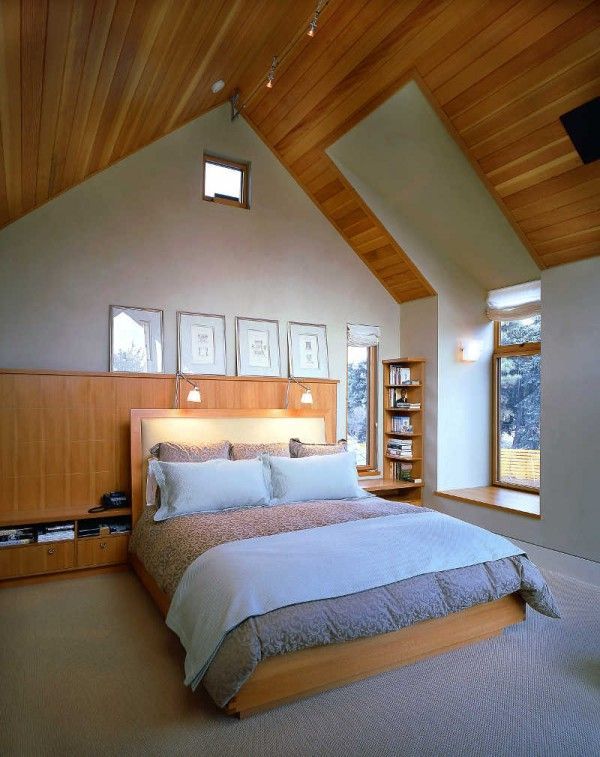 moden bedroom in the attic with wooden walls