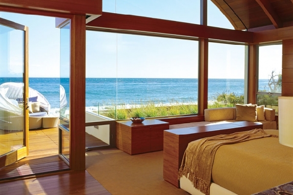 contemporary bedroom decoration with teak furniture, terrace and sea views