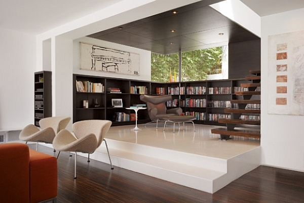 contemporary  designed living room with wood paneled library