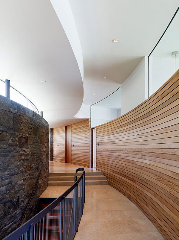 home perched on a cliff with ocean views 10 - staircase hallway design