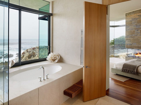 home perched on a cliff with ocean views 12 - luxury bedroom bathroom design