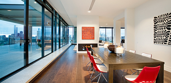 Clarendon-Penthouse-large-colorful-dining-area-with-fireplace-and-terrace-view