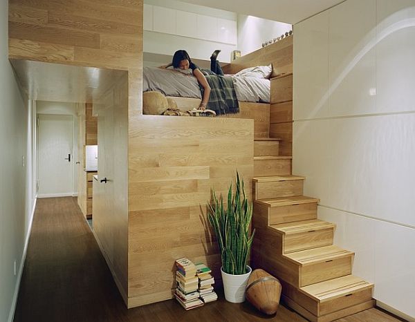 Studio loft stairs with hidden drawers and reading nook