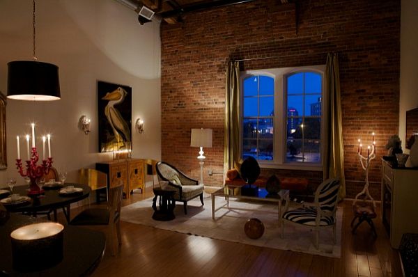 beautiful living room with exposed brick wall against white wall