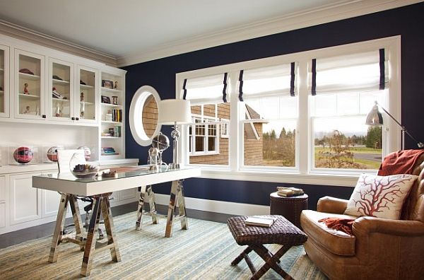 black and white home office with blue wall and roman shades