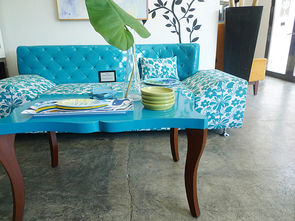blue floral prints couch with wall sticker and blue coffee table
