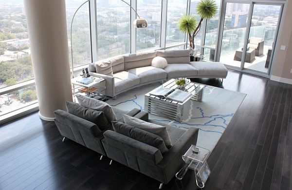 bright living room with large windows & green plants